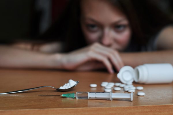 What Non-Addicts Should Know About Addiction - woman looking at drugs - great oaks recovery center