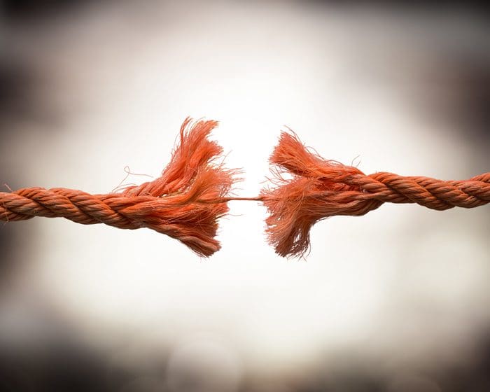 closeup - frayed rope about to break - stress