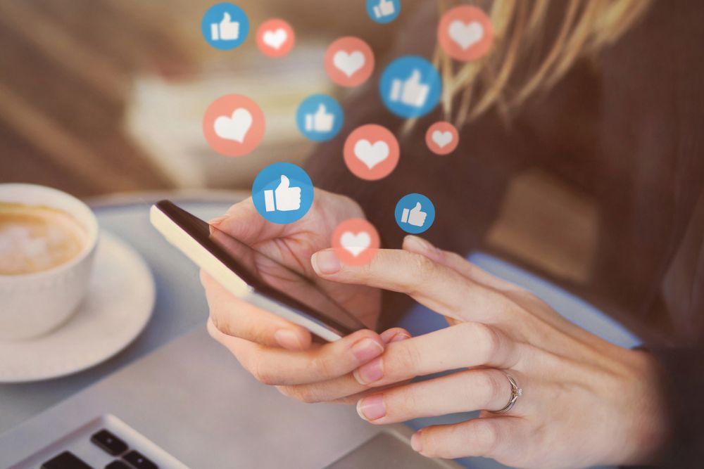 likes on social media on smartphone, online communication